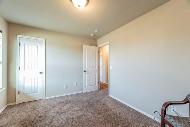 unfurnished bedroom with carpet flooring