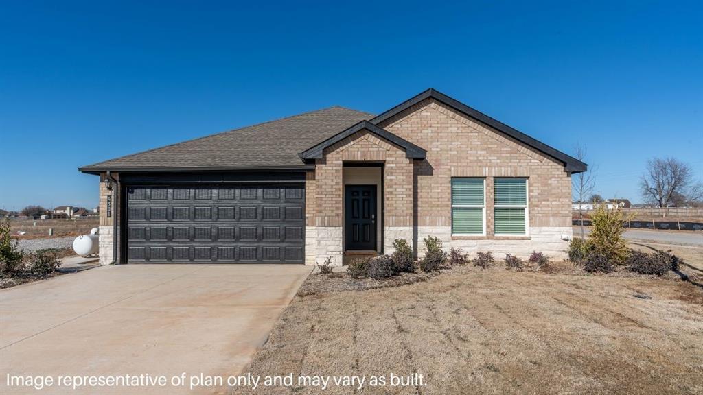 2130 SW 43rd St, Lawton, OK 73505 - ranch-style home with brick siding, an attached garage, driveway, and roof with shingles