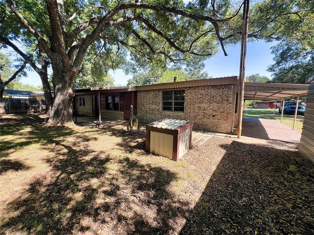 rear view of house with a carport