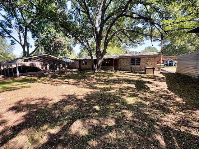 view of yard with a carport