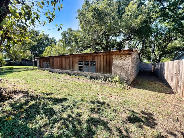 view of outdoor structure featuring a yard