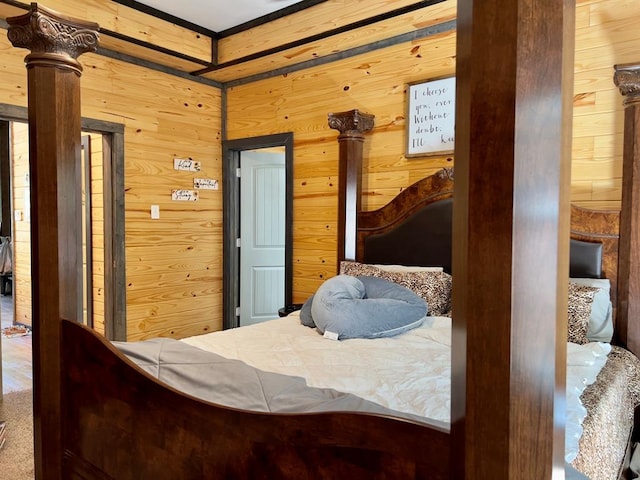 bedroom with wooden walls