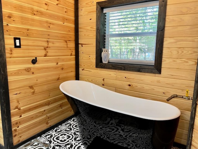 bathroom with wood walls and a tub