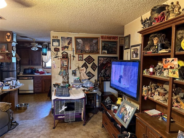 interior space with a textured ceiling and ceiling fan