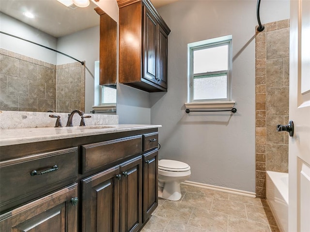 full bathroom featuring toilet,  shower combination, and vanity