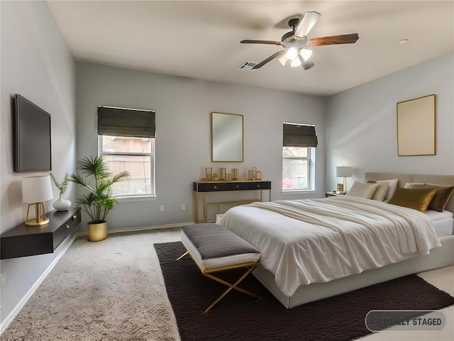 carpeted bedroom featuring ceiling fan