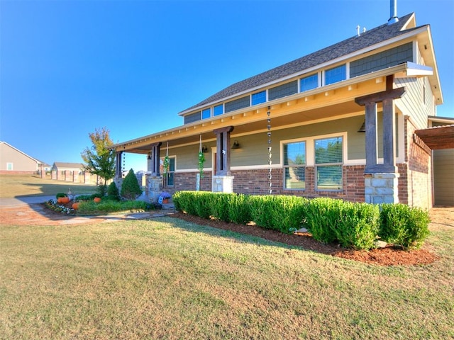 view of front facade featuring a front lawn and a porch