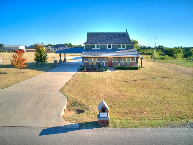 view of front of property with a front yard, a carport, and covered porch