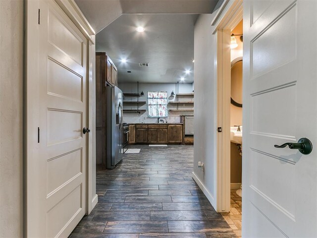 corridor featuring dark hardwood / wood-style floors