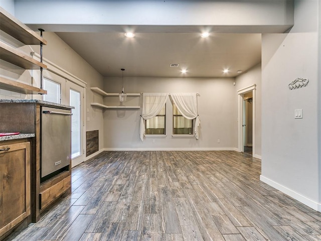 unfurnished living room featuring hardwood / wood-style flooring