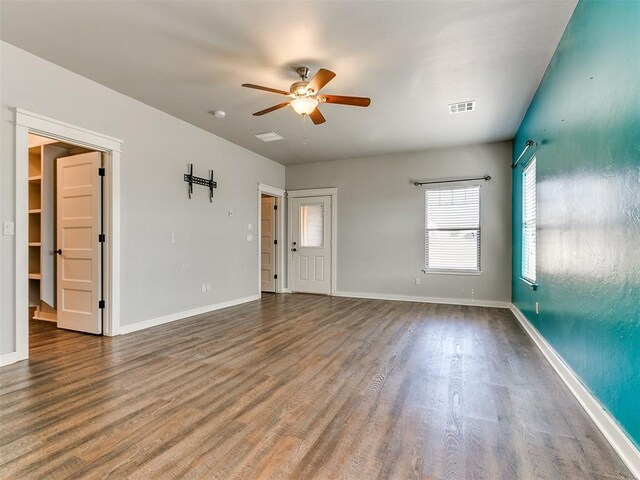 spare room featuring wood-type flooring and ceiling fan