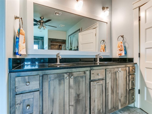 bathroom featuring a shower, vanity, ceiling fan, and tile patterned flooring