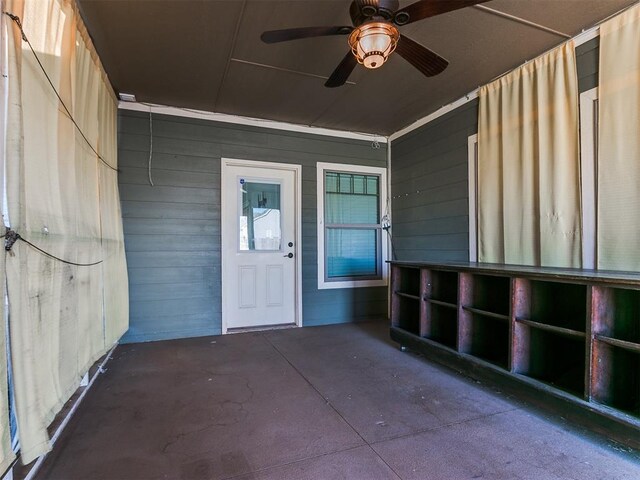 entrance to property featuring ceiling fan