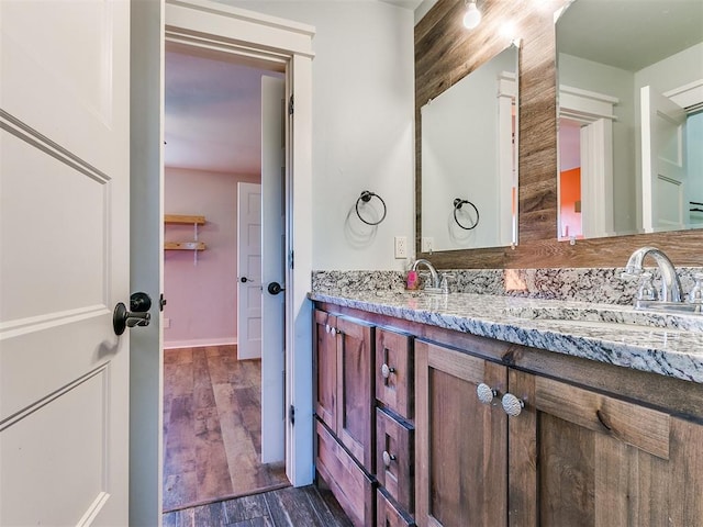 bathroom featuring hardwood / wood-style floors and vanity