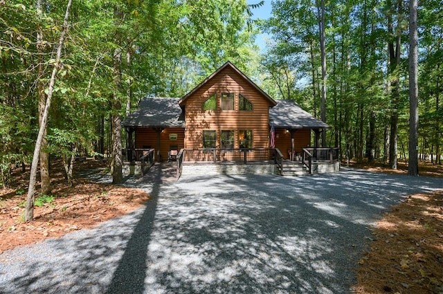 log cabin featuring a deck