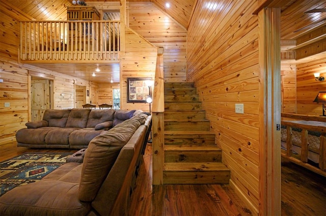 living room with hardwood / wood-style flooring, wooden ceiling, and wood walls