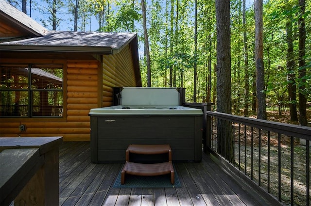 wooden terrace with a hot tub