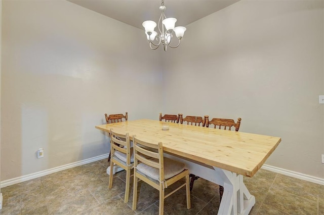 dining space featuring an inviting chandelier