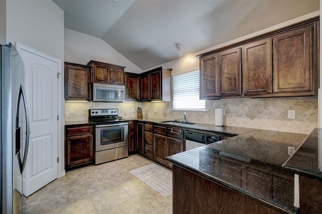 kitchen with backsplash, sink, stainless steel appliances, and lofted ceiling