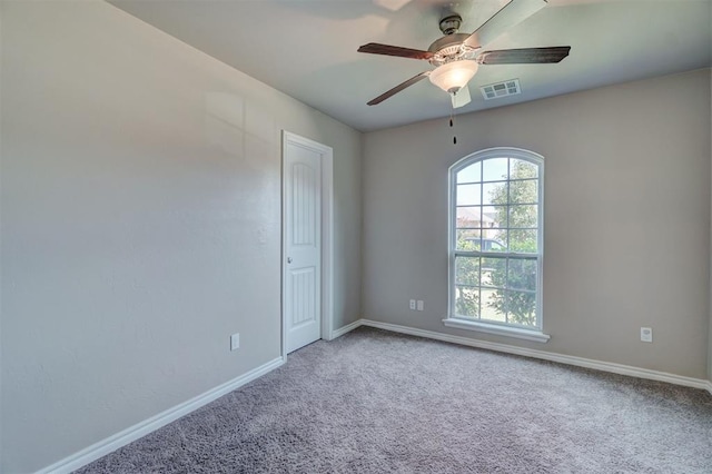 unfurnished room with carpet flooring and ceiling fan