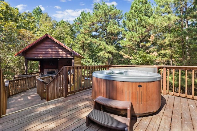 wooden deck with a hot tub