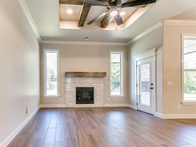 unfurnished living room with hardwood / wood-style floors and a healthy amount of sunlight