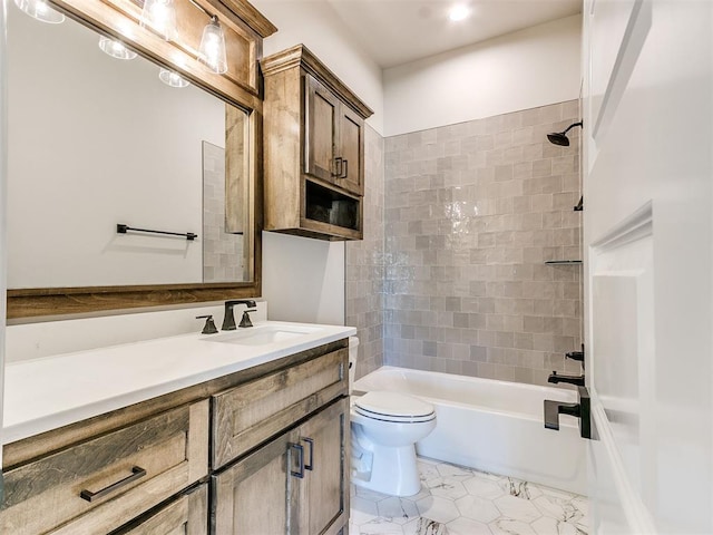 full bathroom featuring tile patterned flooring, tiled shower / bath combo, toilet, and vanity