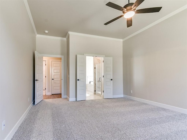 unfurnished bedroom with ceiling fan, ensuite bathroom, ornamental molding, and light carpet