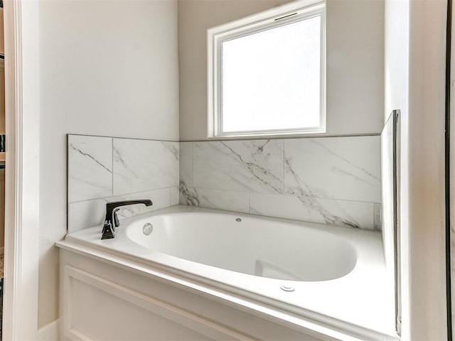 bathroom featuring a washtub