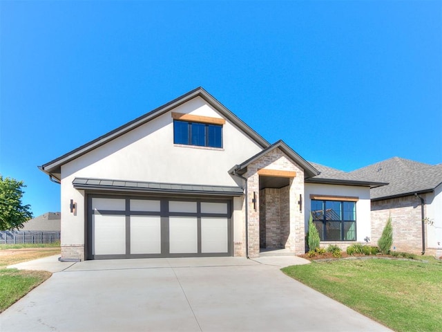 view of front facade featuring a front yard and a garage