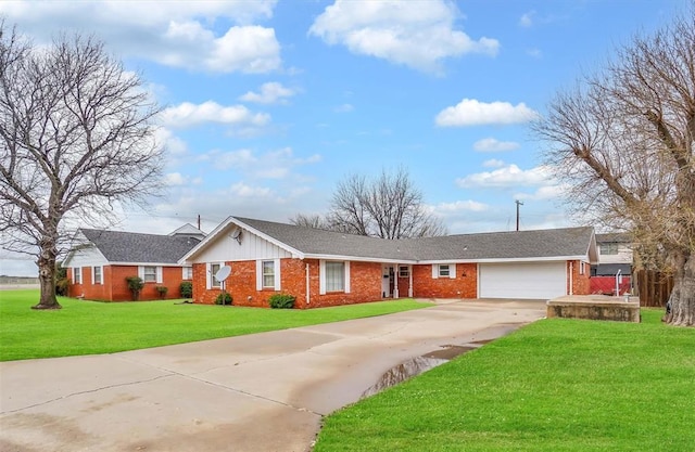 ranch-style home with a front yard and a garage