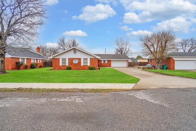 ranch-style house featuring a front yard and a garage