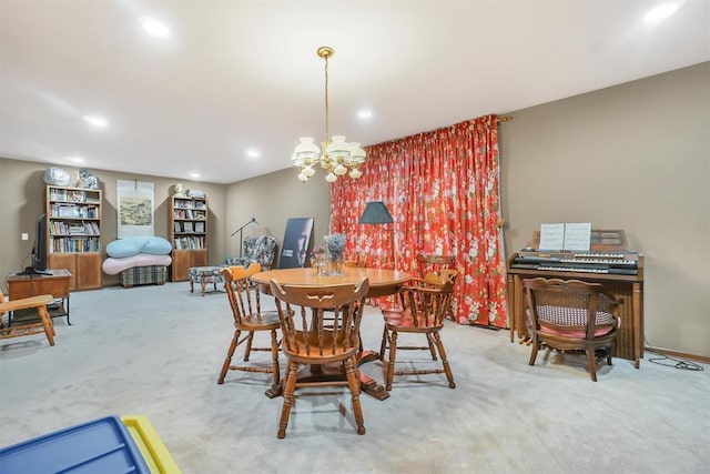 dining room featuring carpet and a chandelier