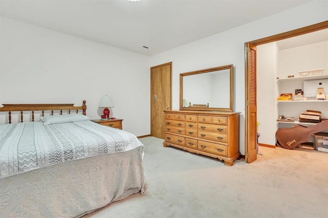 carpeted bedroom featuring a closet