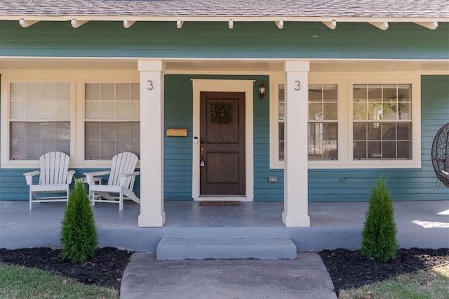 doorway to property with a porch