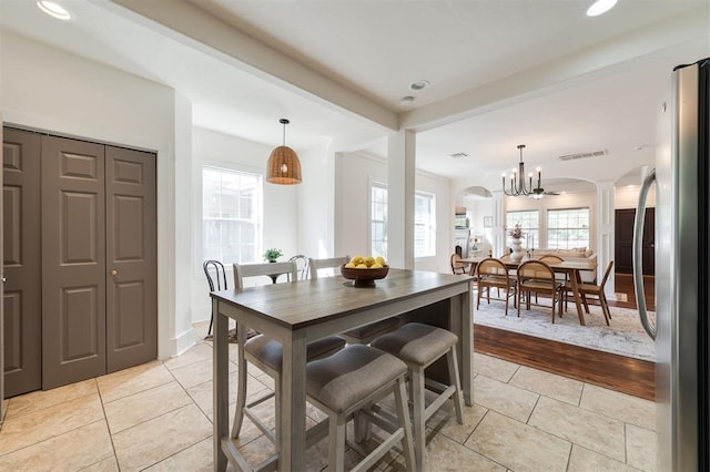 dining room featuring light hardwood / wood-style floors and a notable chandelier