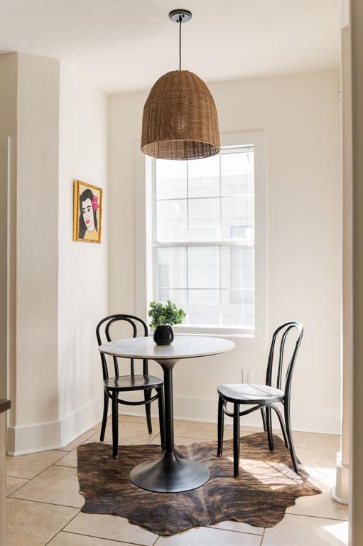 dining space with light tile patterned floors