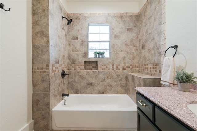 bathroom featuring vanity and tiled shower / bath