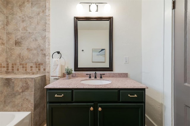 bathroom with a tub to relax in and vanity