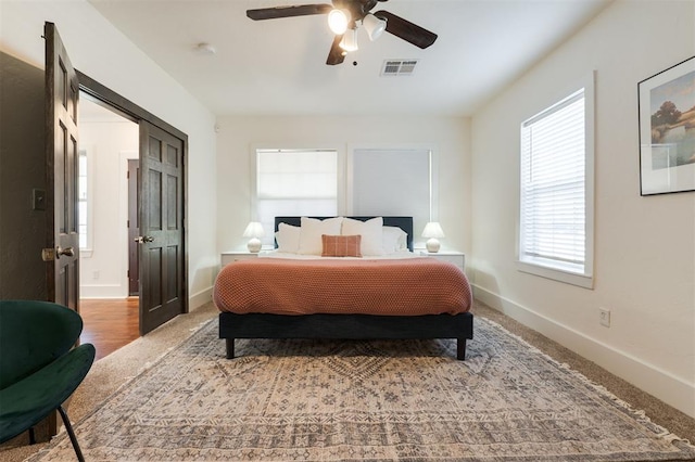 bedroom featuring hardwood / wood-style flooring and ceiling fan