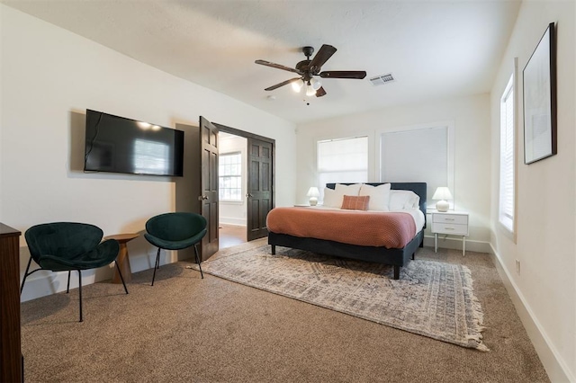 carpeted bedroom featuring ceiling fan