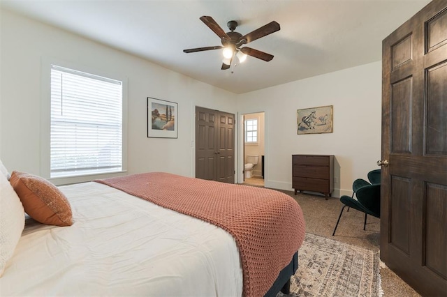 bedroom featuring multiple windows, ceiling fan, and light carpet