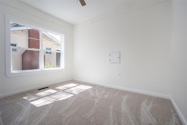 unfurnished room featuring carpet floors and ceiling fan