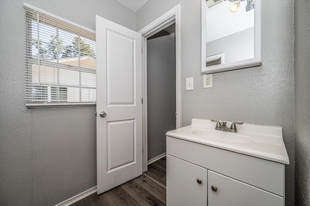 bathroom featuring vanity and hardwood / wood-style flooring