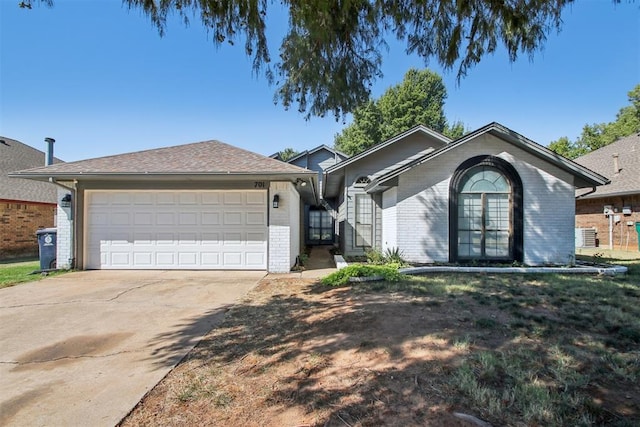 single story home with a garage