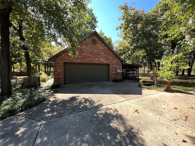 garage with concrete driveway