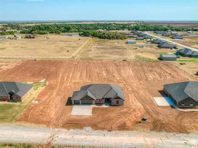 birds eye view of property featuring a rural view