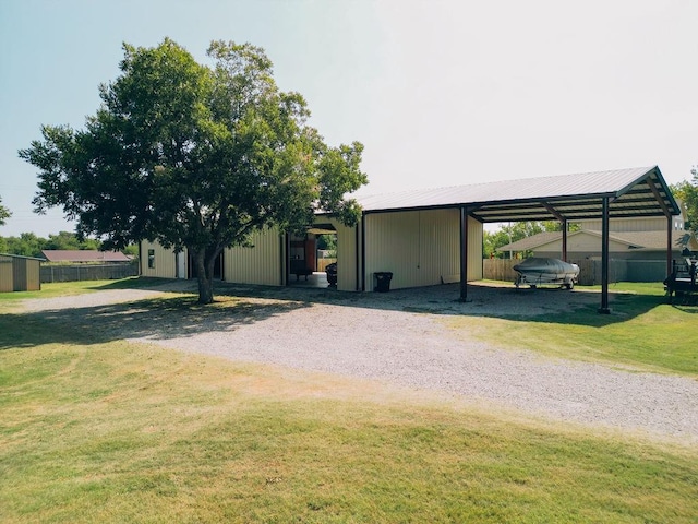 exterior space with an outdoor structure and a carport