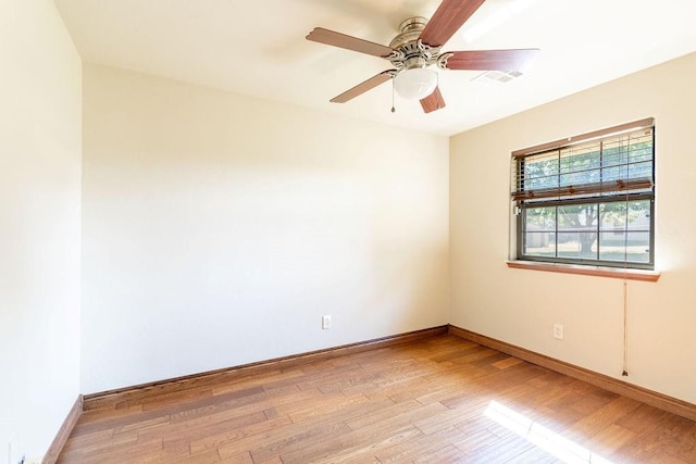 spare room featuring ceiling fan and light hardwood / wood-style flooring