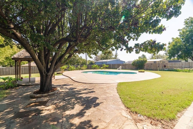 view of pool featuring a lawn, a patio area, and a gazebo